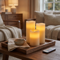Three ivory flameless candles glowing on a walnut tray, Wick & Wool