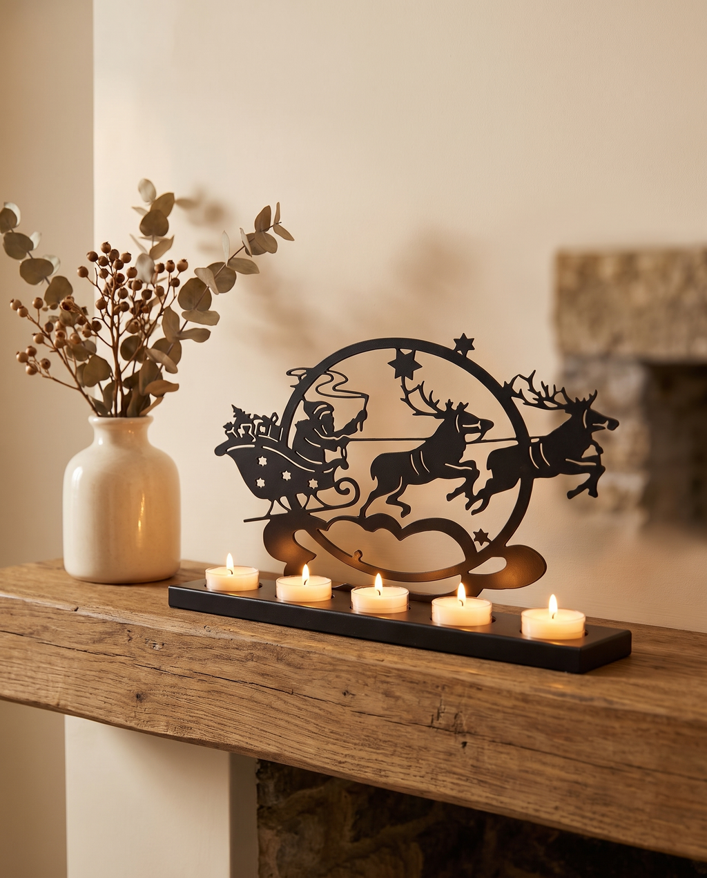 Santa sleigh tealight holder on a wooden mantel
