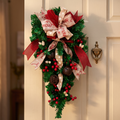 Christmas teardrop wreath on a cream front door