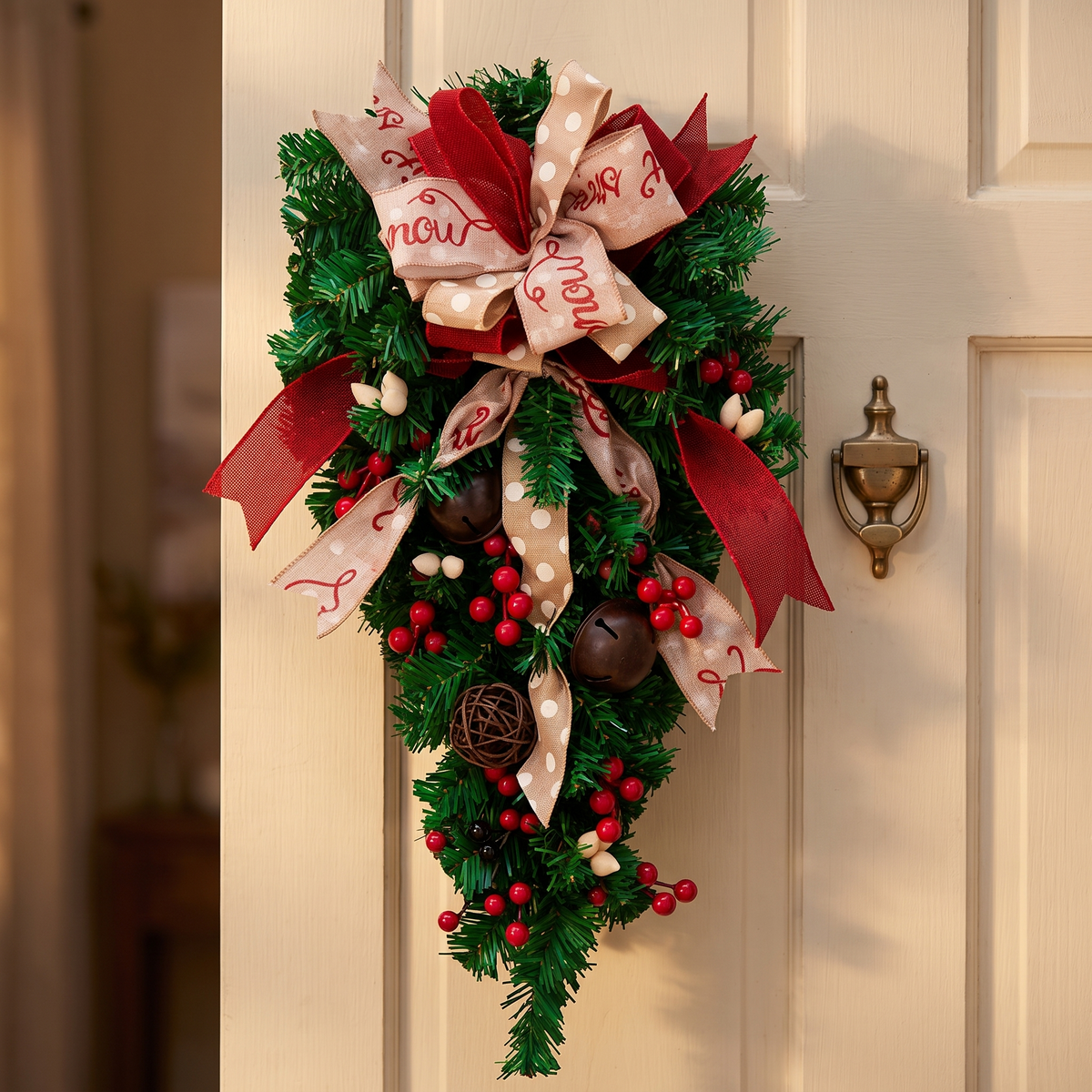 Christmas teardrop wreath on a cream front door